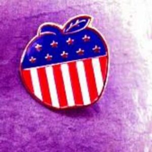 Red, white, and blue apple pin representing patriotism